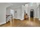 Welcoming foyer with hardwood floors, staircase, and an open entryway at 3022 Woodbridge Ln, Canton, GA 30114