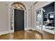 Inviting foyer featuring hardwood floors, and a front door with sidelights and transom window at 3022 Woodbridge Ln, Canton, GA 30114