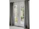 French doors with gray curtains leading to the outdoors provide ample light and privacy at 3022 Woodbridge Ln, Canton, GA 30114
