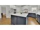 Modern kitchen boasts a large center island, stainless steel appliances, and ample cabinet space at 3022 Woodbridge Ln, Canton, GA 30114