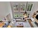 The living room boasts high ceilings, large windows, and a fireplace as seen from above at 3022 Woodbridge Ln, Canton, GA 30114