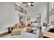 Open living room with vaulted ceilings and a spiral staircase provides a spacious feel at 3022 Woodbridge Ln, Canton, GA 30114