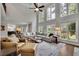 The living room showcases high ceilings, large windows, and an open floor plan at 3022 Woodbridge Ln, Canton, GA 30114