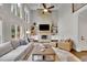 Bright living room features a cozy fireplace, neutral decor, and abundant natural light at 3022 Woodbridge Ln, Canton, GA 30114
