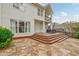 Inviting patio with stone flooring and multi-level deck, ideal for outdoor dining and relaxation, with an outdoor grill at 3022 Woodbridge Ln, Canton, GA 30114