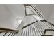 Looking up a staircase with black iron railings and wood handrails at 3022 Woodbridge Ln, Canton, GA 30114