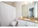 Bathroom features a shower/tub combo, granite countertop, and a mirror at 5888 Riverstone Cir # 15, Atlanta, GA 30339