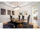 Modern dining room with stylish lighting, elegant decor, and a spacious layout at 5888 Riverstone Cir # 15, Atlanta, GA 30339