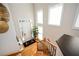 Spacious foyer featuring hardwood floors, large windows, and a staircase at 5888 Riverstone Cir # 15, Atlanta, GA 30339