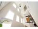 Bright foyer with soaring ceilings, tall windows, and stylish lighting fixture creating an airy, open space at 5888 Riverstone Cir # 15, Atlanta, GA 30339