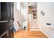 Welcoming foyer with hardwood floors, staircase, and natural light streaming through the windows at 5888 Riverstone Cir # 15, Atlanta, GA 30339