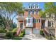 Beautiful brick townhouse with two-car garage, well-manicured landscaping and welcoming front entrance at 5888 Riverstone Cir # 15, Atlanta, GA 30339
