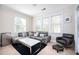 Comfortable and naturally lit living room featuring plush seating, mini fridge, and a modern coffee table at 5888 Riverstone Cir # 15, Atlanta, GA 30339