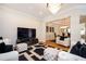 Open-concept living room with modern decor, hardwood floors, and an inviting atmosphere at 5888 Riverstone Cir # 15, Atlanta, GA 30339
