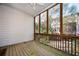 Screened porch with wood flooring, wood frame, and view of backyard at 5888 Riverstone Cir # 15, Atlanta, GA 30339