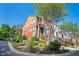 Charming brick townhomes with lush greenery and well-maintained lawns line a quiet neighborhood street at 5888 Riverstone Cir # 15, Atlanta, GA 30339