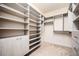 Spacious walk-in closet with custom shelving and storage options at 5888 Riverstone Cir # 15, Atlanta, GA 30339
