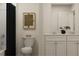 Modern bathroom with a double sink vanity, a black shower curtain, and a minimalist design at 120 Sunny Side Way, Acworth, GA 30102
