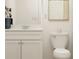 Elegant bathroom featuring a white vanity with marble countertop, complemented by chic decor at 120 Sunny Side Way, Acworth, GA 30102
