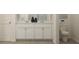 Elegant bathroom featuring double vanity with white cabinets, stylish fixtures, and a modern toilet at 120 Sunny Side Way, Acworth, GA 30102