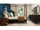 Bright bedroom features a canopy bed, chic decor, and lots of natural light at 120 Sunny Side Way, Acworth, GA 30102
