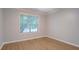Inviting bedroom with wood-look flooring, a ceiling fan and natural light from the window at 1917 Kevin Dr, Conyers, GA 30013