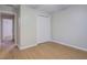 Spacious bedroom with wood-look flooring, closet, and neutral walls offers a versatile living space at 1917 Kevin Dr, Conyers, GA 30013
