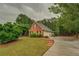 Beautiful home with a two-car garage, well-maintained lawn, and lovely landscaping at 1917 Kevin Dr, Conyers, GA 30013