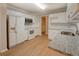Bright kitchen with white appliances, granite countertops, and ample cabinet space at 1917 Kevin Dr, Conyers, GA 30013