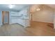 Modern kitchen with white cabinets, stainless steel appliances, and an adjacent living space at 1917 Kevin Dr, Conyers, GA 30013