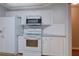 Modern kitchen with white appliances and lots of counter space at 1917 Kevin Dr, Conyers, GA 30013