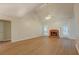 Spacious living room with a fireplace, hardwood floors, and access to the backyard at 1917 Kevin Dr, Conyers, GA 30013