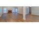 Open concept living room with a fireplace, hardwood floors, and plenty of natural light at 1917 Kevin Dr, Conyers, GA 30013