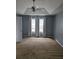 Bedroom with vaulted ceiling, fan, neutral carpet and large windows for natural light at 204 Millpond Pkwy, Villa Rica, GA 30180