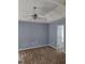 Spacious bedroom with neutral carpet, ceiling fan, and ensuite bathroom at 204 Millpond Pkwy, Villa Rica, GA 30180
