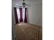 Bedroom featuring neutral carpet and a ceiling fan, illuminated by natural light at 204 Millpond Pkwy, Villa Rica, GA 30180