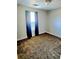 Bedroom featuring neutral carpet and a ceiling fan, illuminated by natural light at 204 Millpond Pkwy, Villa Rica, GA 30180