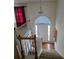 Bright foyer featuring a white door with sidelights, hardwood floors, and staircase at 204 Millpond Pkwy, Villa Rica, GA 30180