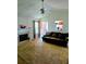 Cozy living room with fireplace, ceiling fan and comfortable dark-colored sofa at 204 Millpond Pkwy, Villa Rica, GA 30180