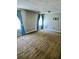 Spacious Living Room with carpet flooring and large windows at 204 Millpond Pkwy, Villa Rica, GA 30180