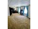 Spacious living room with carpet flooring and large windows at 204 Millpond Pkwy, Villa Rica, GA 30180