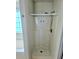 Shower stall with detachable shower head and integrated molded shelving at 204 Millpond Pkwy, Villa Rica, GA 30180