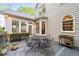 A large outdoor back deck is surrounded by the home's siding and many potted plants at 205 Wellesley Ct, Woodstock, GA 30189