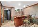 Custom wet bar featuring wood trim and wainscotting and vintage seating at 205 Wellesley Ct, Woodstock, GA 30189