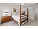 Bright bedroom with a four-poster bed and furniture at 205 Wellesley Ct, Woodstock, GA 30189