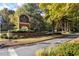 Community entrance with brick sign and lush landscaping welcomes residents to Wellesley at Towne Lake at 205 Wellesley Ct, Woodstock, GA 30189