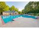 Resort-style community pool with lounge chairs and umbrellas for relaxation and enjoyment at 205 Wellesley Ct, Woodstock, GA 30189