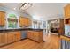 Well-lit kitchen with hardwood floors, granite countertops, and stainless steel appliances at 205 Wellesley Ct, Woodstock, GA 30189