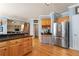 Spacious kitchen featuring stainless steel appliances, granite countertops, and hardwood floors at 205 Wellesley Ct, Woodstock, GA 30189