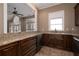 Kitchenette features granite countertops, ample cabinet space, and modern appliances at 205 Wellesley Ct, Woodstock, GA 30189